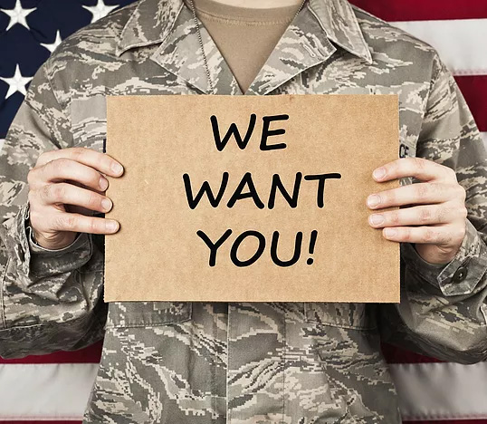 Solider Veteran holding a sign